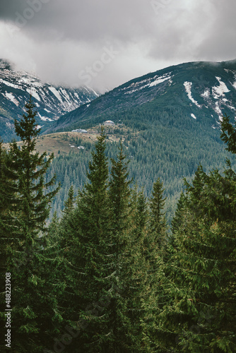 A sign on the side of a snow covered mountain