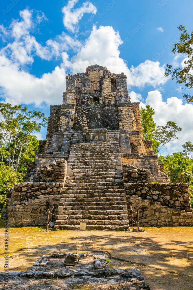 Ancient Mayan site with temple ruins pyramids artifacts Muyil Mexico.