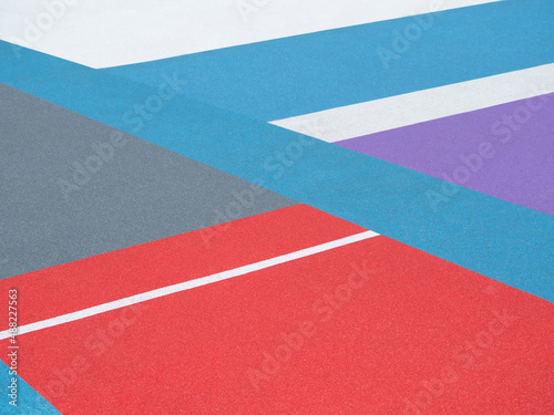 Closeup of sports ground texture with color lines © lilkin
