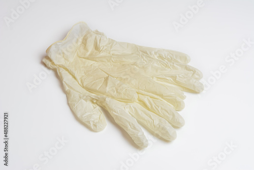 White medical gloves on a white background. Rubber medical gloves. Individual protection means.