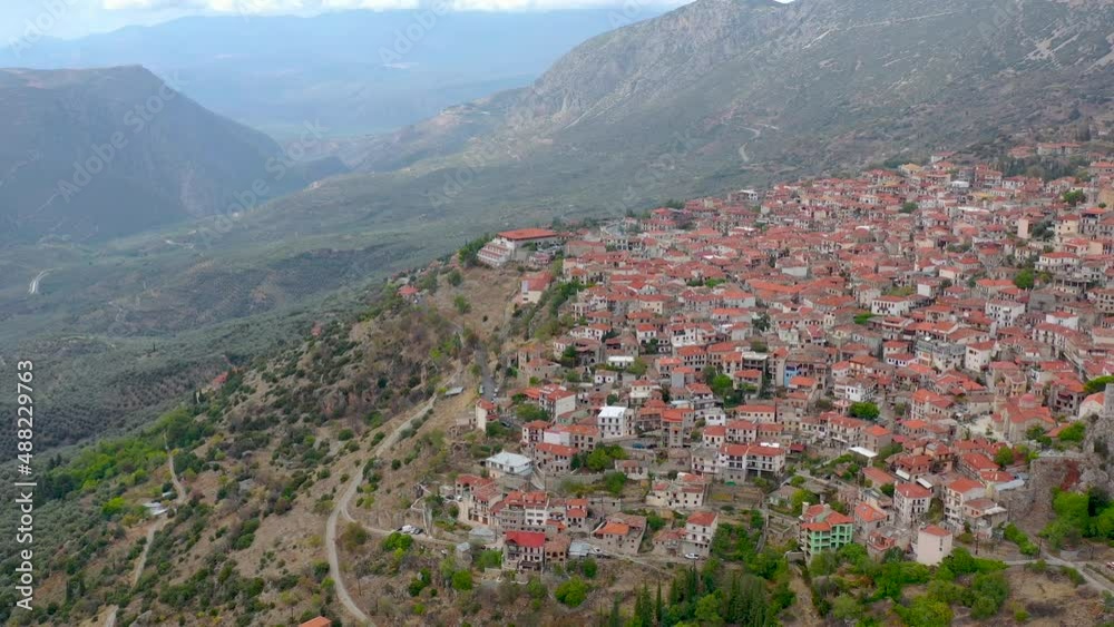 Aerial view of Arachova village in the mountains of Greece, Europe. An area near the ancient Greek city of Delphi. Historic Village on a Hill. Aerial view of Arachova village in the mountains of Greece, Europe. An area near the ancient Greek city of Delphi. Historic Village on a Hill.