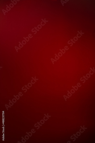 Vertical Abstract red with black darkened edges background for design, text and captioning, copyspace