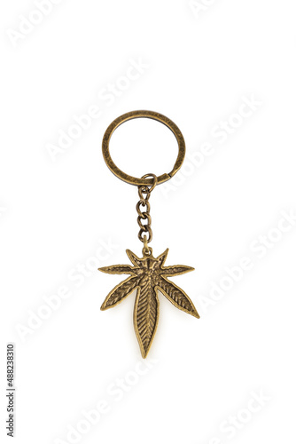 Golden key ring pendant marijuana, isolated