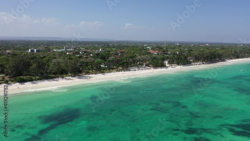 boats jachts on water sea Drone view Coastline Diani beach landscape Kenyan African Sea  aerial 4k waves blue indan ocean tropical mombasa turquoise white sand East Africa palms paradise wit coral photo