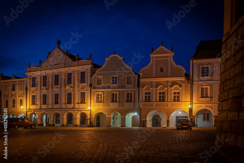 Telc town in winter night with orange street lamps