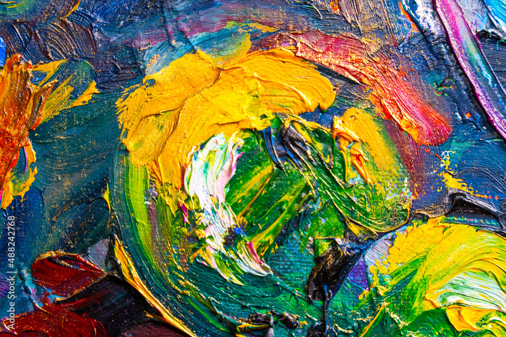 Abstract image painted with large sweeping strokes of oil paint on the surface of canvas, close up. Creative work of the artist. Colorful and bright background.