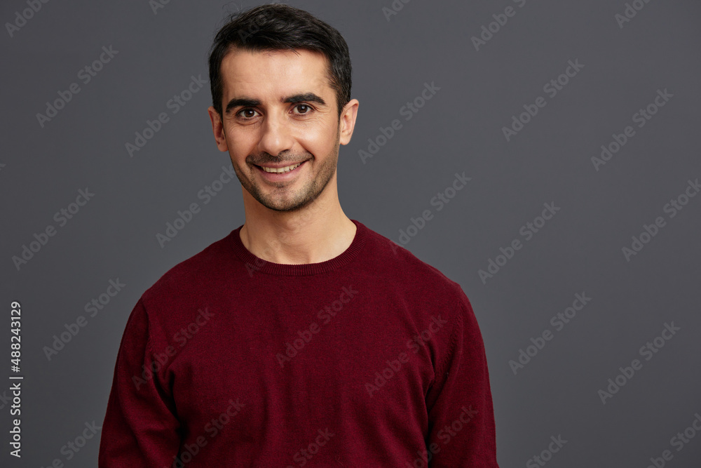 handsome man in a red sweater hand gesture posing self confidence cropped view handsome man in a red sweater hand gesture posing self confidence cropped view