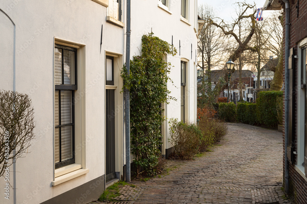 Narrow street in the idyllic village of Vreeland along the river Vecht.