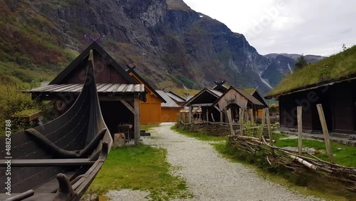 Viking ship and viking houses on viking village