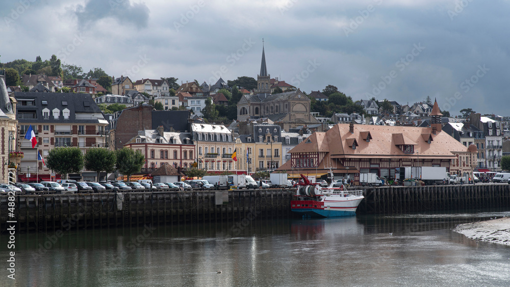 Typical Normandy house and boats in the port of Trouville in Normandy, France