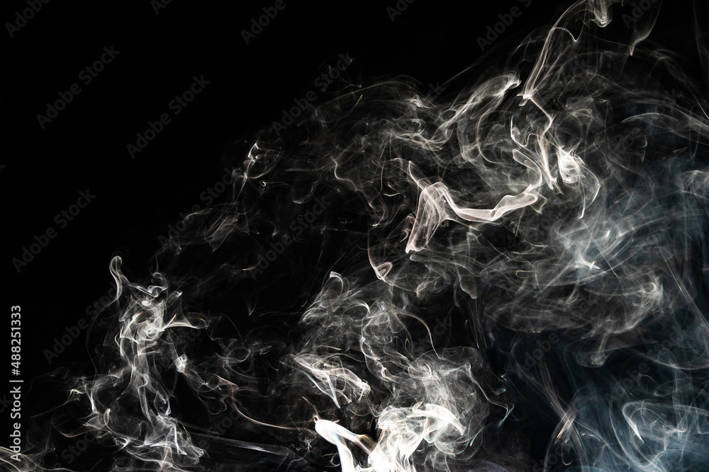 Obraz premium Smoke effect texture. Isolated background. Black and dark backdrop. Smokey fire and mistic effect.