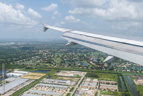 Photography Airplane view through window of plane landing in Fort Myers international airpor