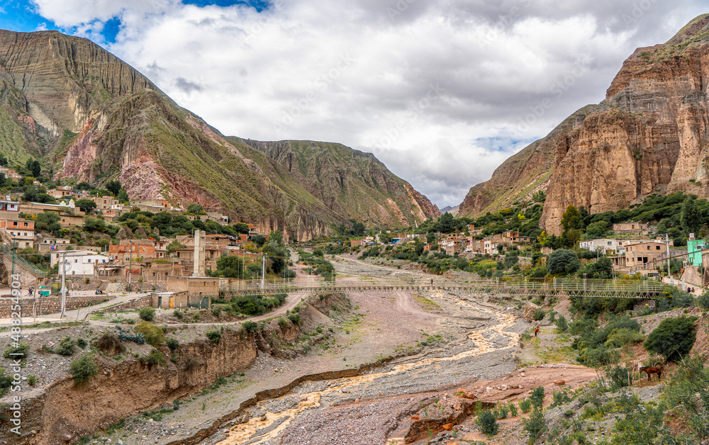 Argentina, the village of Iruya,  view of the amazing mountain landscape and the riverbed with the bridge.