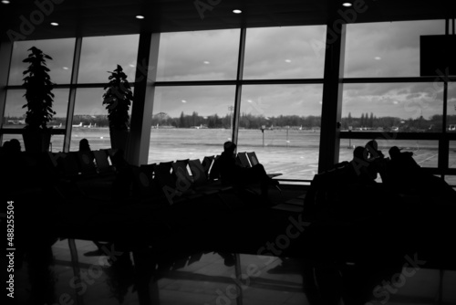 International airport with people in the hall black white photo photo