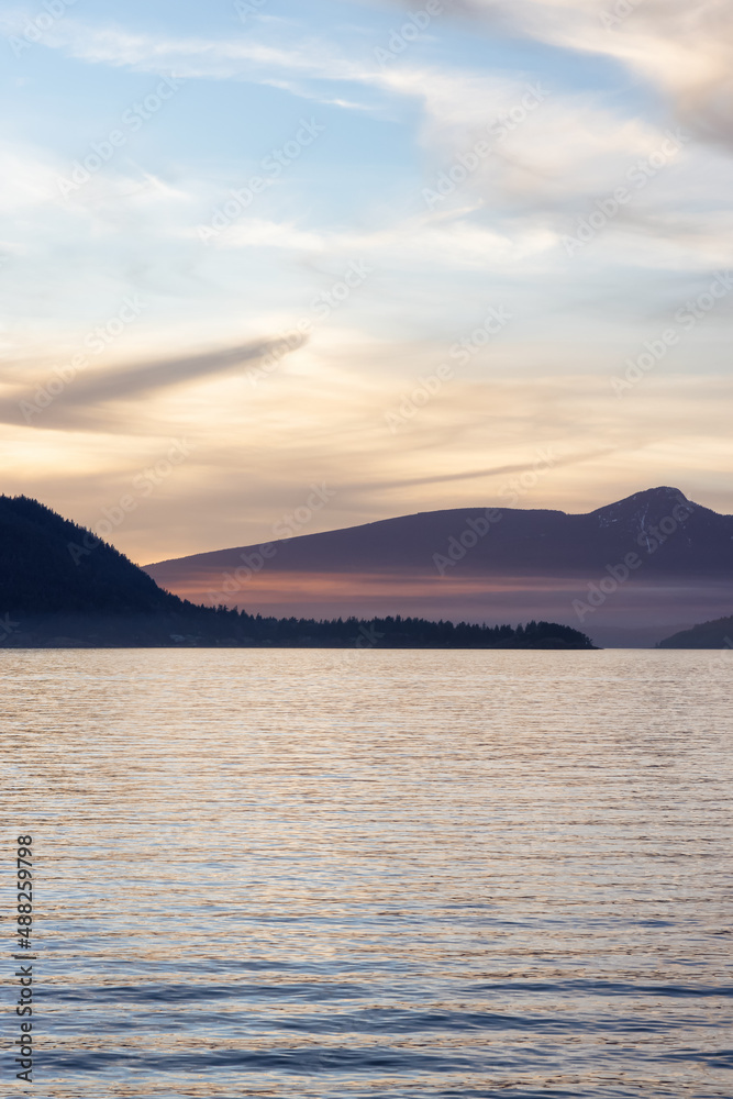 Canadian Nature Mountain Landscape on the Pacific Ocean West Coast. Colorful Winter Sunset. Taken in Howe Sound near Horseshoe Bay, West Vancouver, British Columbia, Canada. Background