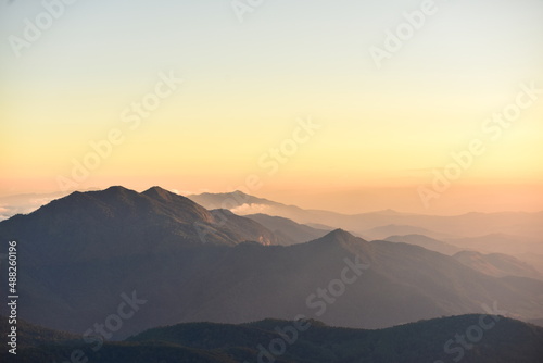 mountain peak at sunrise © tharathip
