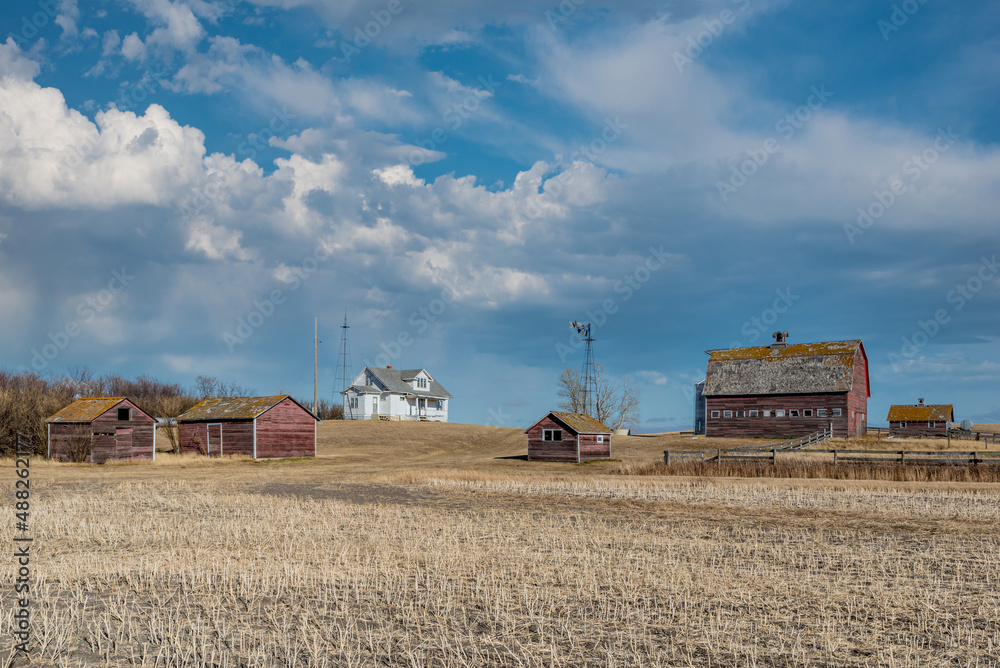 Fototapeta premium Abandoned farm buildings on the prairies in Saskatchewan, Canada