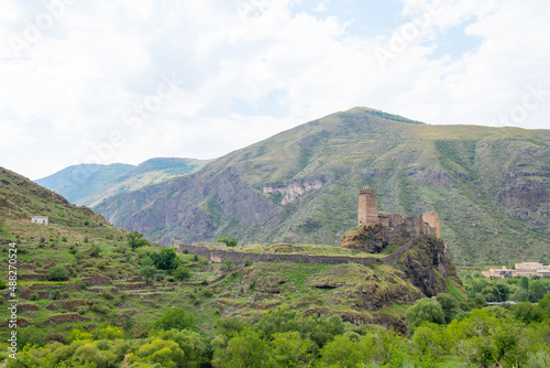 ruined beautiful fortress is visible from the road photo