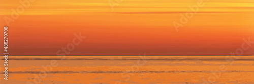 Fantasy on the theme of the sea landscape, summer vacation. The picturesque sunset sky, ripples in the water.