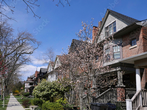 Photography Urban residential street with row of semi-detached houses with front gardens