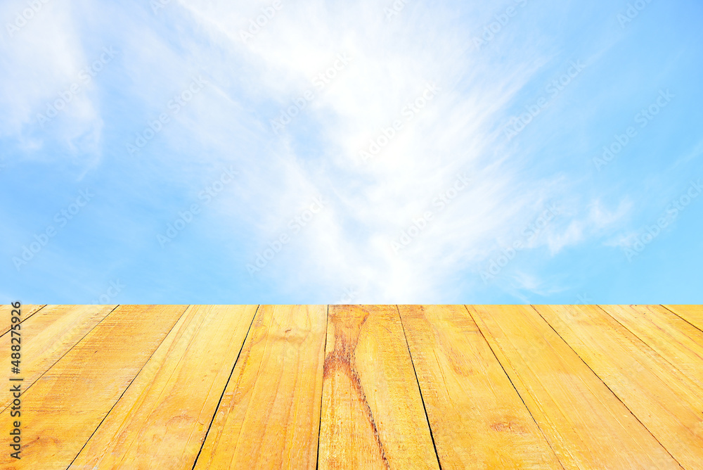Blue sky and white clouds for background.wood background.