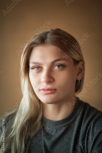 Studio portrait of a young beautiful blonde girl.