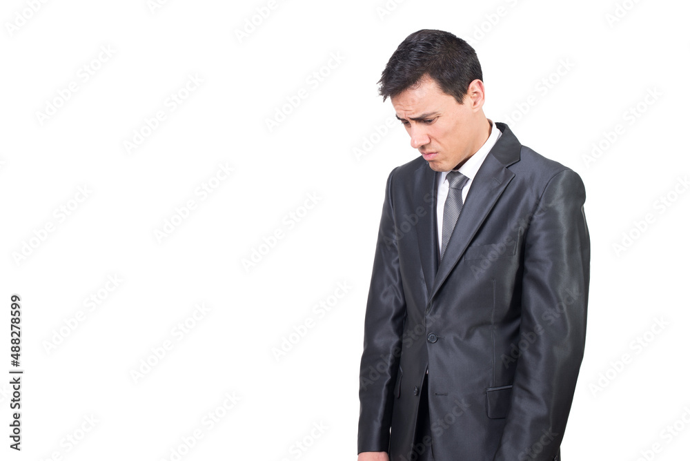 Unhappy man in elegant suit looking down Unhappy man in elegant suit looking down