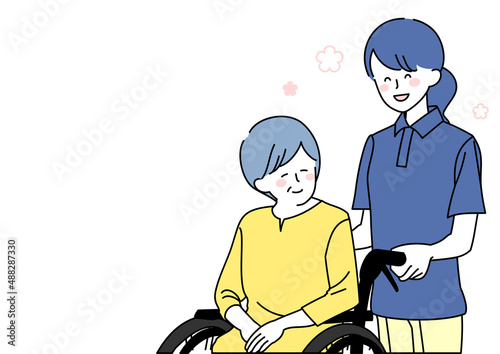 和気あいあいとした介護士と車椅子に乗ったシニア