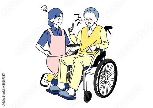 当たり散らす車椅子のシニアと辟易する介護士
