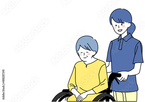 和気あいあいとした介護士と車椅子に乗ったシニア