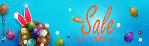 Blue poster with Easter eggs in nests, rabbit ears