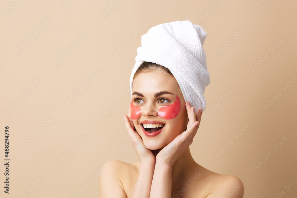 beautiful woman skin care face patches bare shoulders beige background beautiful woman skin care face patches bare shoulders beige background