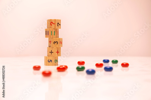 Wooden cubes with numbers, children's game. Place for text