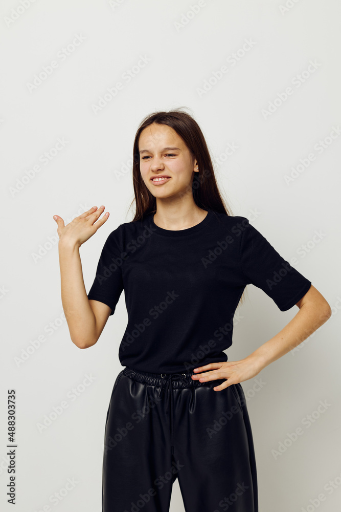 athletic woman in a black t-shirt hand gesture fun isolated background athletic woman in a black t-shirt hand gesture fun isolated background