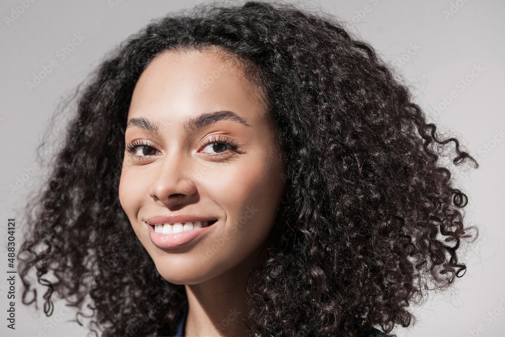 Closeup portrait of beautiful smiling young woman. Laughing joyful cheerful girl close-up studio shot Closeup portrait of beautiful smiling young woman. Laughing joyful cheerful girl close-up studio shot
