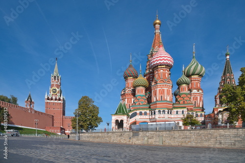 Cathedral of the Intercession of the Most Holy Theotokos, on the Moat (St. Basil's Cathedral) and the Spasskaya Tower of the Moscow Kremlin on an autumn sunny day, Russia