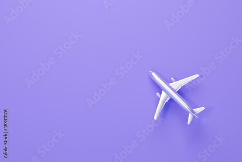 Top view flat lay of minimal toy model plane, airplane. World Tourism Day, airplane isolated on a pastel purple background, accessory flight holiday concept. 3d render 