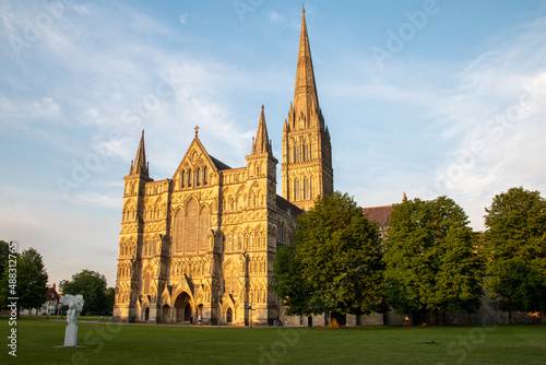 West façade of Salisbury Cathedral, Wiltshire, against a clear blue sky. July 2021