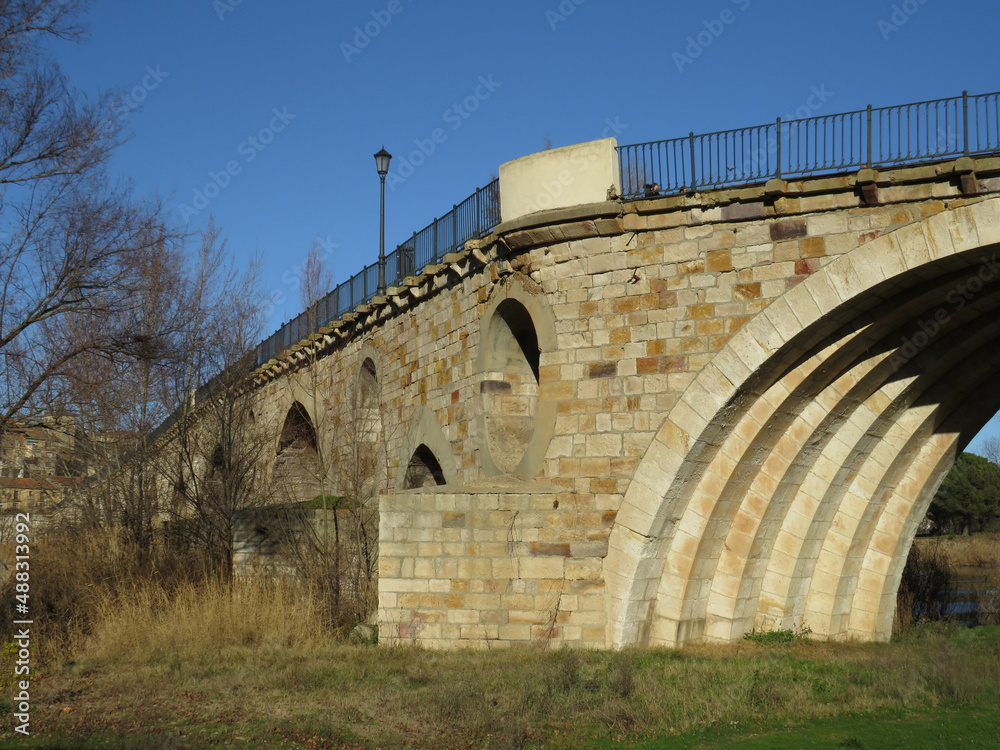 Historic Bridge of Stone on the Duero river in the city of Zamora. Spain.
