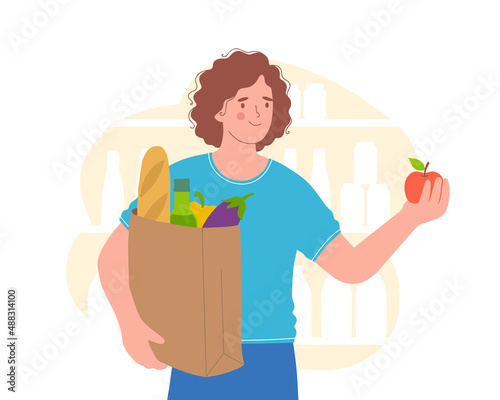 Young woman holds bag of natural products. Woman in store is stocking up on food. Concept of healthy eating