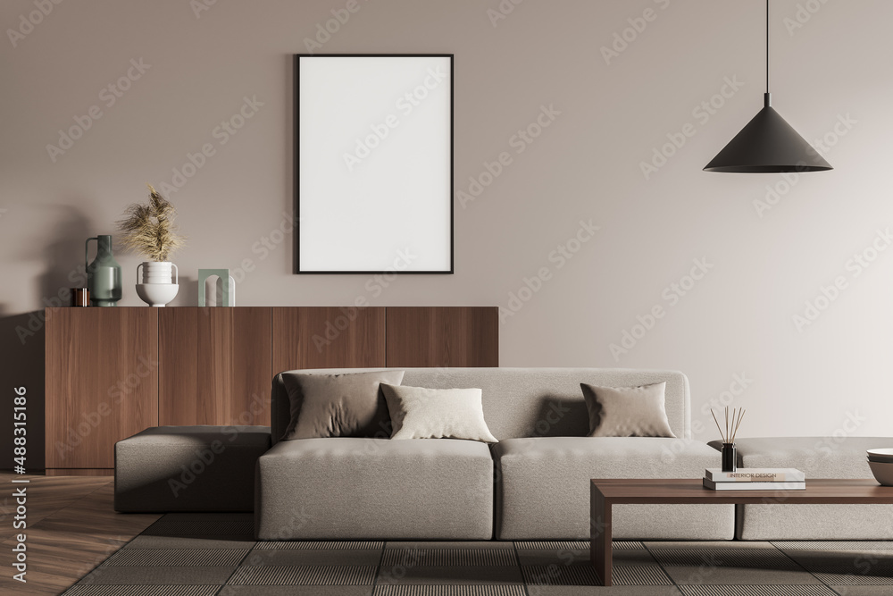 Fototapeta Living room interior with empty white framed mockup poster on wall, sofa, table, commode, hardwood flooring. Concept of minimalist design. Creative idea. Mock up. 3d rendering