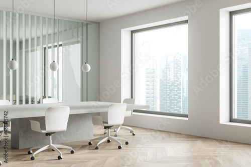 Office room interior with seats  table and panoramic window with city view
