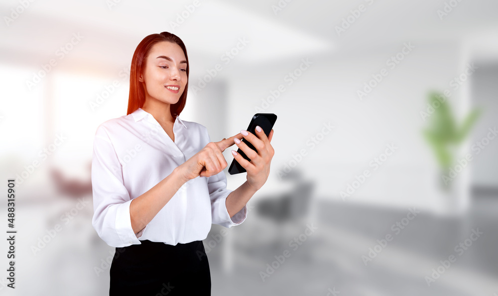 Smiling young attractive businesswoman wearing formal suit is ho Smiling young attractive businesswoman wearing formal suit is ho