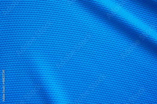 Blue football jersey clothing fabric texture sports wear background, close up top view