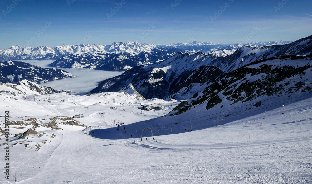 View from Kitsteinhorn on the ski slope and the Zell am See valley in the Austrian Alps 