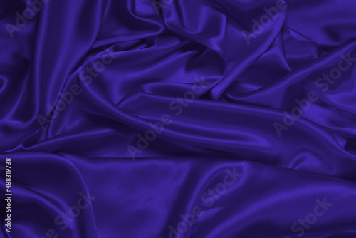Purple silk or satin luxury fabric texture can use as abstract background.