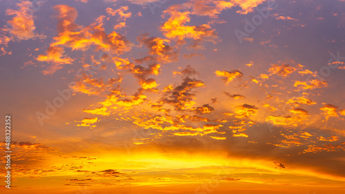 Glowing cloudy in golden hour sky, panoramic nature phenomenon background