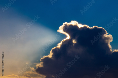 Sunset cloud formations with light rays