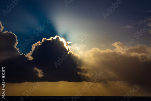Sunset cloud formations with light rays