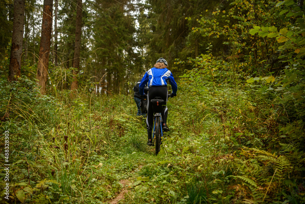 Bicyclist in the forest, Russia Bicyclist in the forest, Russia